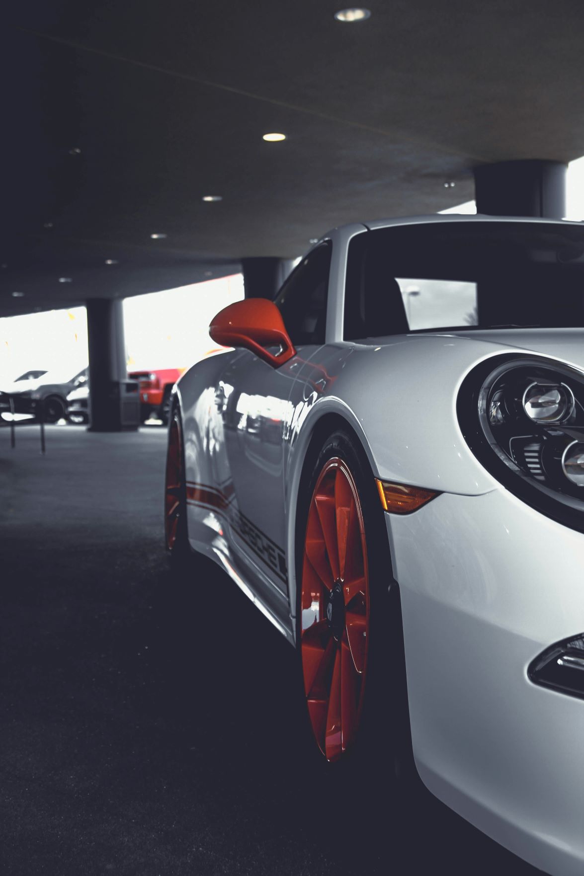White Porsche with red accents and powder coated wheels