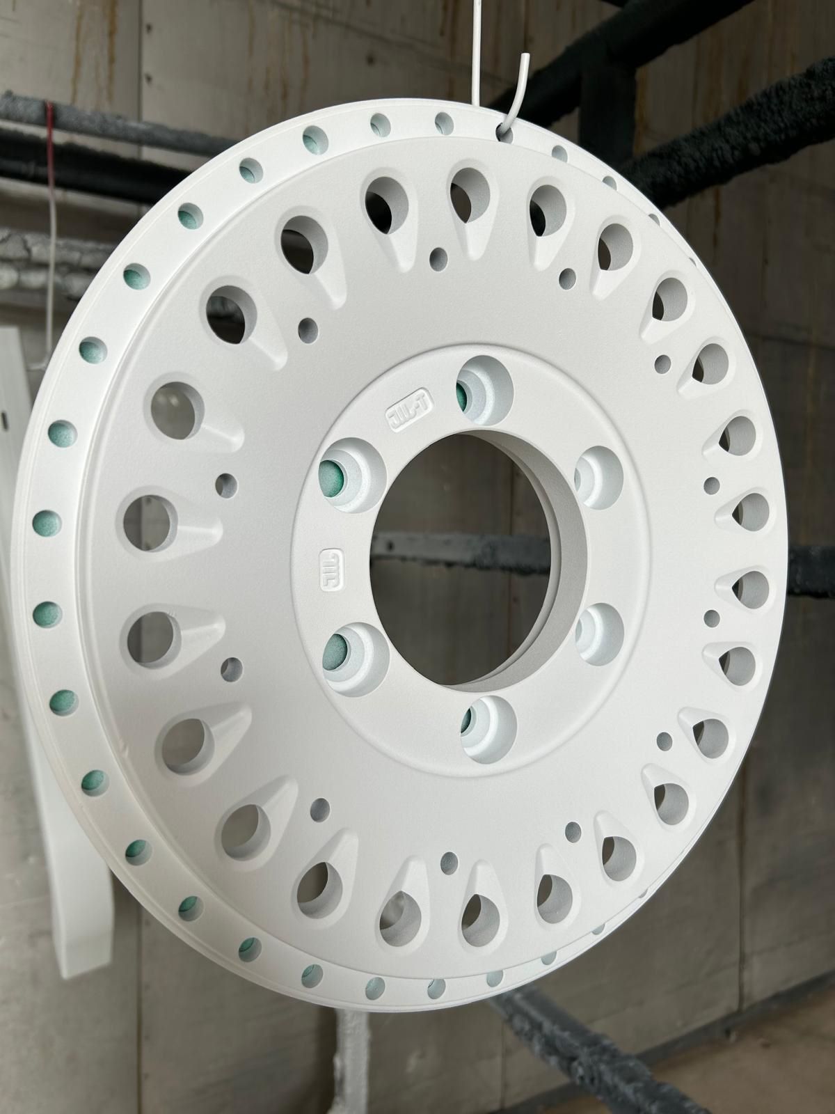 White powder coated metal brake rotor plate