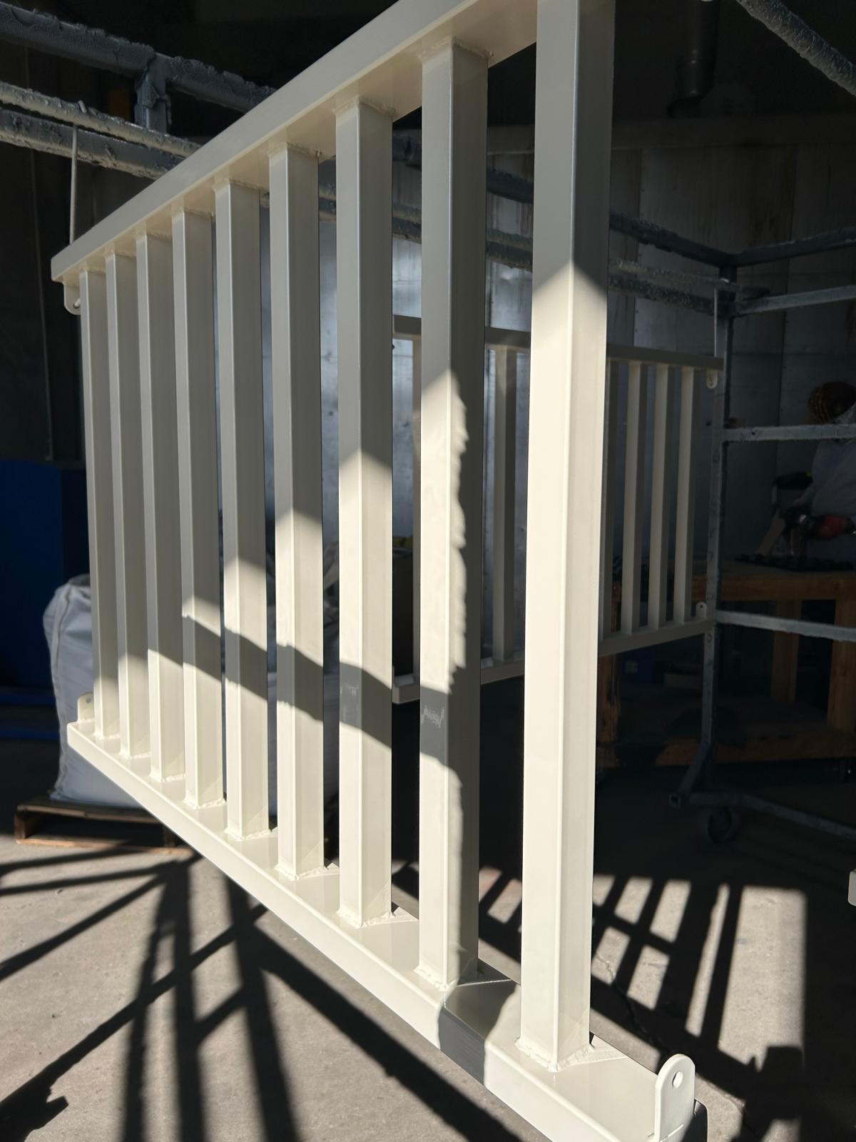 White powder coated metal railing section