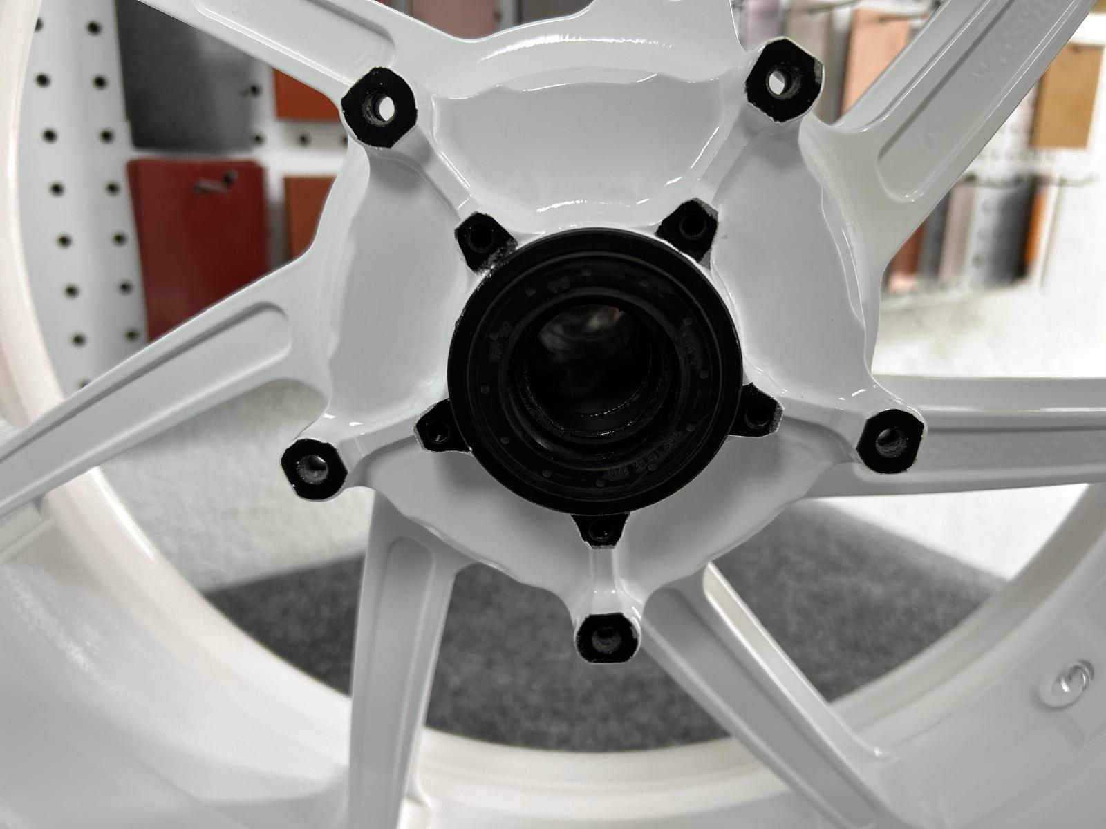 White powder coated wheel with black center hub