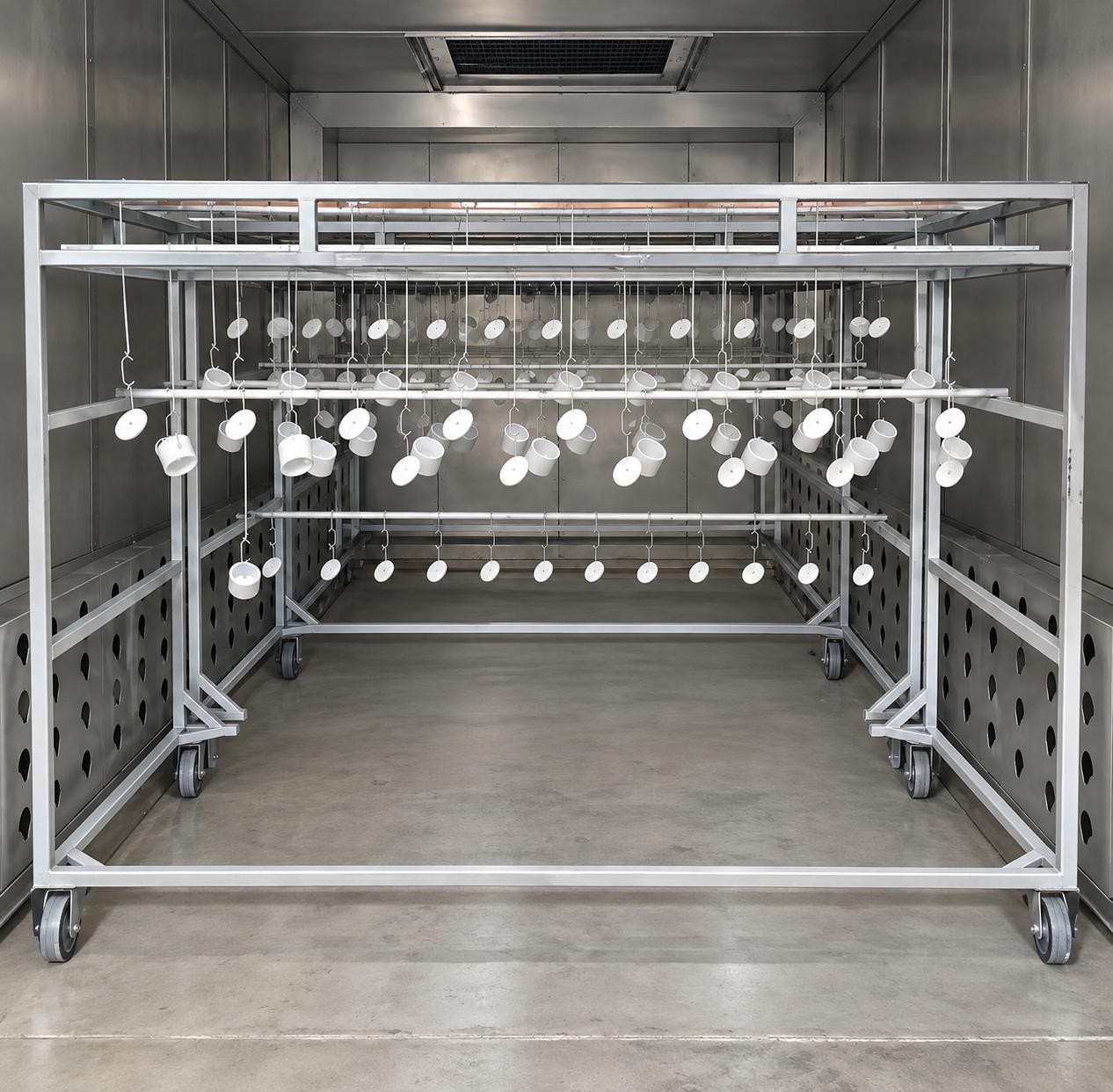 Industrial rack of small parts inside the powder coating booth