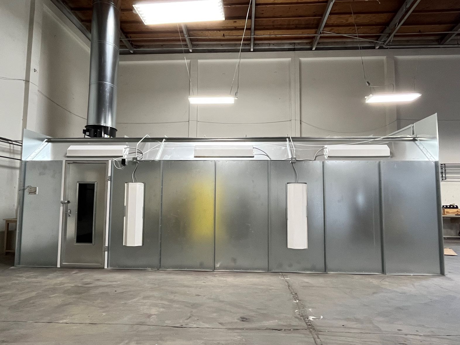 Powder coating booth and curing oven inside the Anocote facility in San Diego